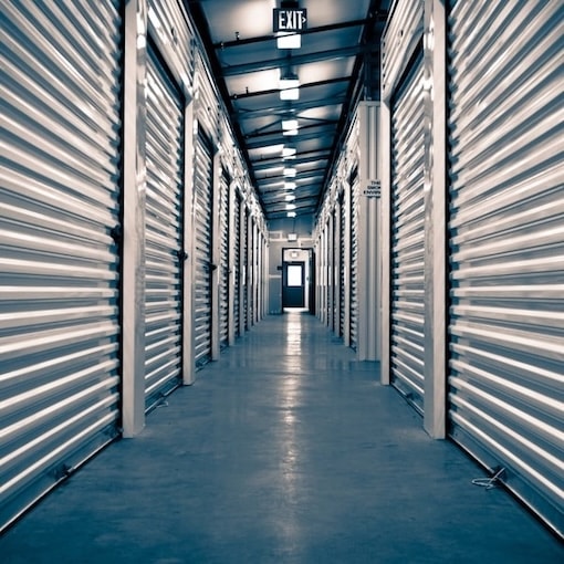 Storage facility interior shot of the hallway with units on either side